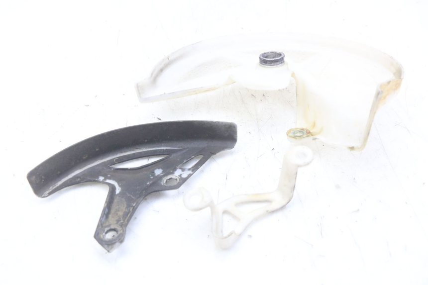 photo de OSŁONA TARCZY HAMULCOWEJ HONDA CRF 250 (2010 - 2013) - Zoom stanu zużycia