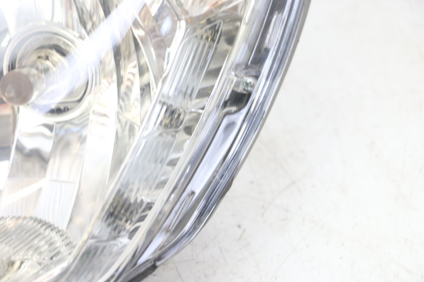 photo de REFLEKTOR PRZEDNI PEUGEOT SATELIS 125 (2013 - 2018) - Stan powierzchni